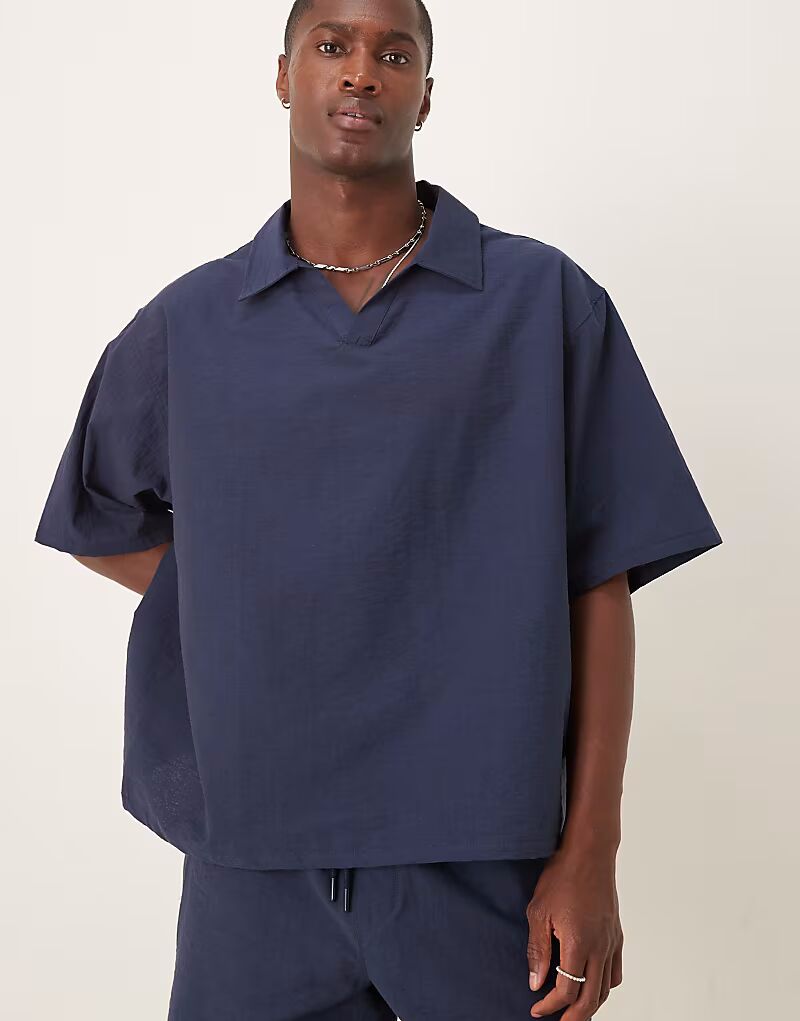 

Рубашка-поло свободного кроя с текстурой темно-синего цвета Asos Design