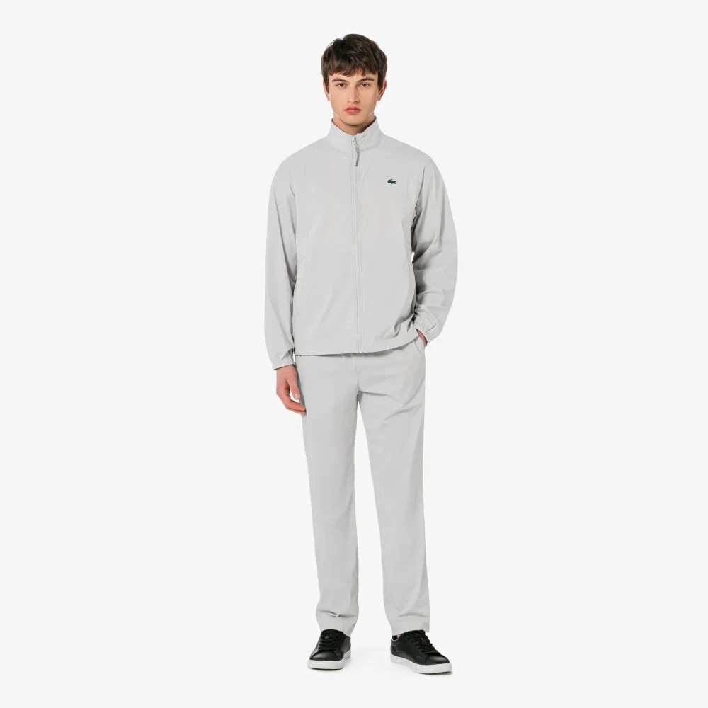 Мужские лёгкие серые брюки из тканого материала от Lacoste — фото 4