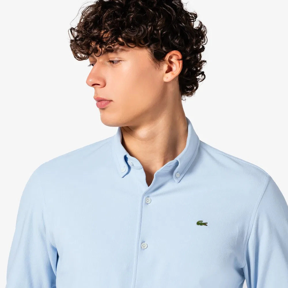 Мужская однотонная рубашка из джерси светло-голубого цвета от Lacoste — фото 2