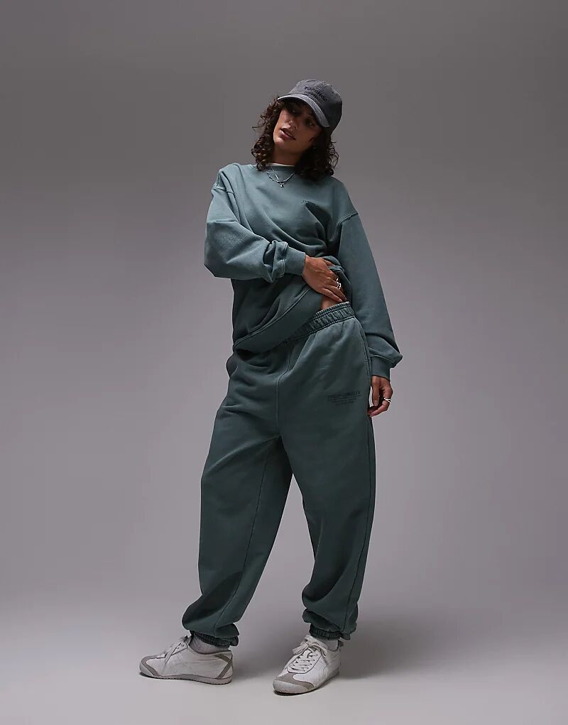 

Спортивные брюки Topshop Community Coord с принтом и манжетами зеленого цвета