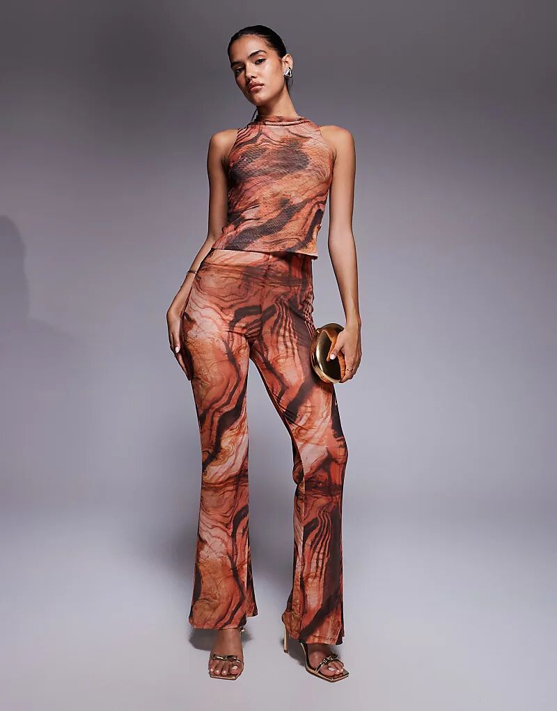 

Комбинируемые прозрачные сетчатые брюки-клеш ASOS DESIGN с оранжевым абстрактным принтом