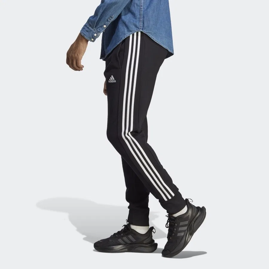 Спортивные брюки с манжетами Essentials French Terry Tapered Cuff 3-Stripes adidas, Черно-белый — фото 2