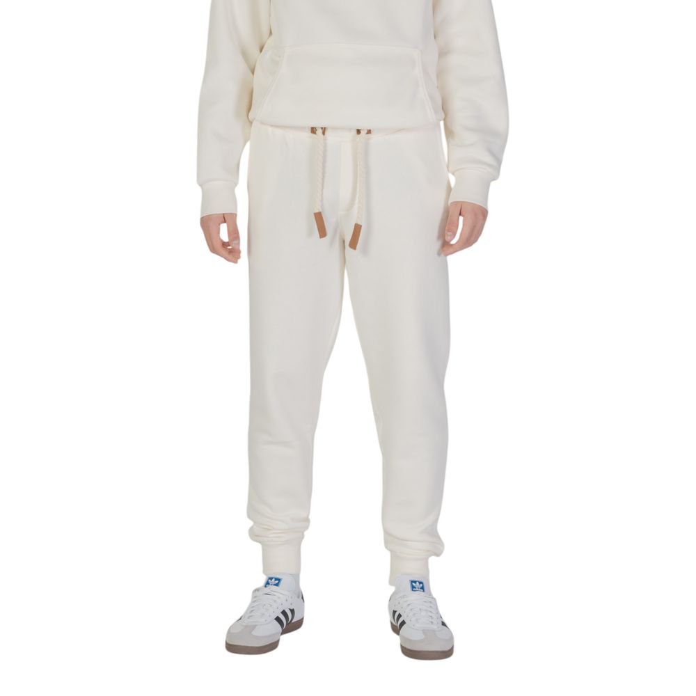 

Джинсы и брюки из хлопка кремового цвета Hydra Clothing