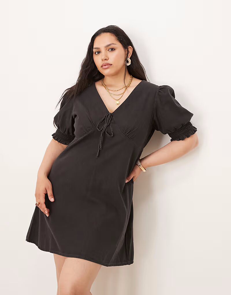 

Мини-платье из мягкого денима ASOS DESIGN Curve с рукавами-фонариками и оборками в черном цвете ASOS Curve