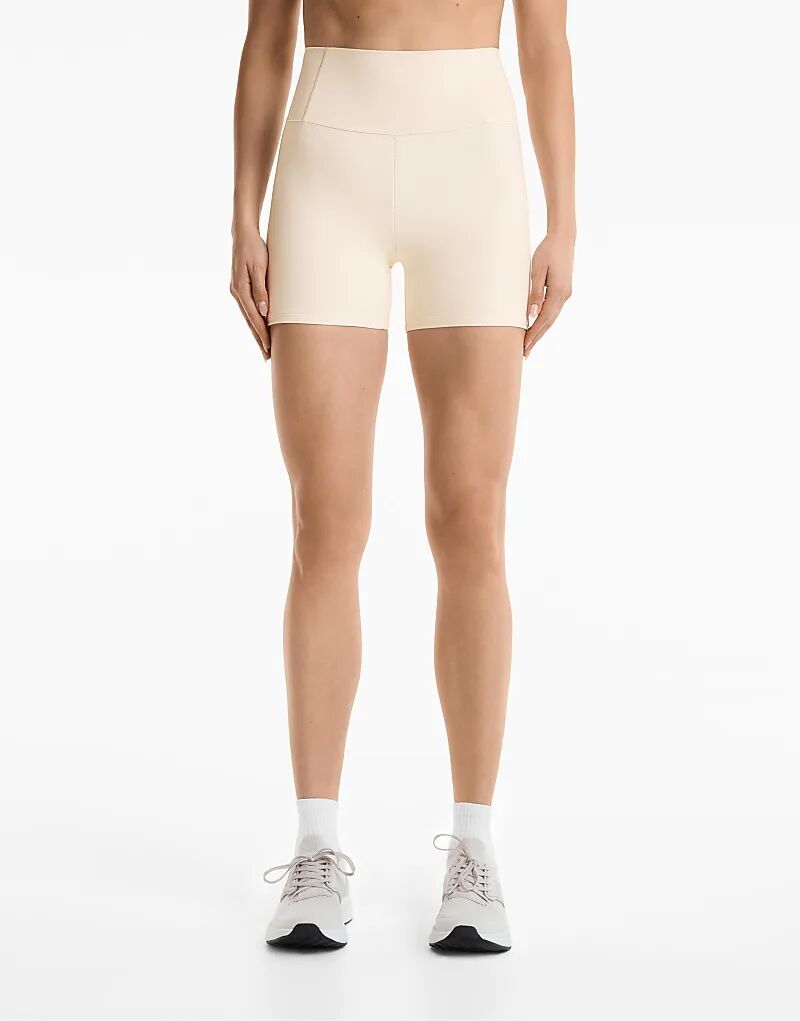 

Компрессионные шорты Oysho Compressive с высокой посадкой 10 см в бледно-бежевом цвете