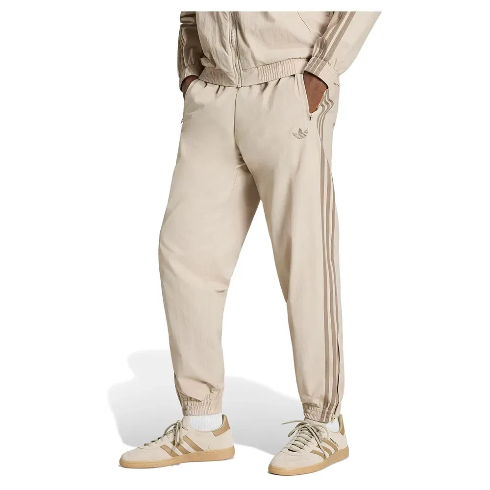 Мужские спортивные брюки из трикотажа Firebird Woven Track Adidas Originals, Beige