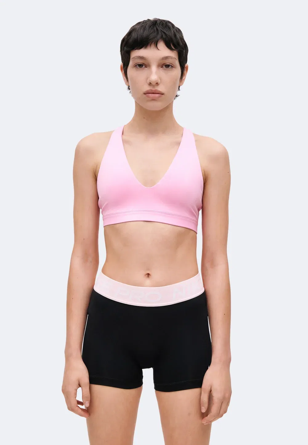 W nk df indy strappy bra - спортивный бюстгальтер со средней поддержкой Nike Performance, Pink Rise/Black