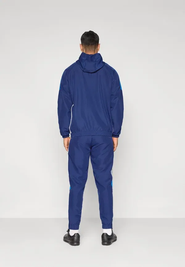 Брюки Tiro 26 essentials - спортивные штаны Adidas Performance, белый/темно-синий — фото 3