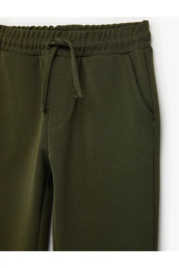 Детские спортивные штаны для мальчиков с принтом Beli lace-up jogger pants with pocket detail Koton, Green — фото 3
