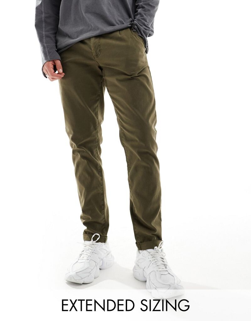 

Узкие потертые чиносы темного хаки ASOS DESIGN