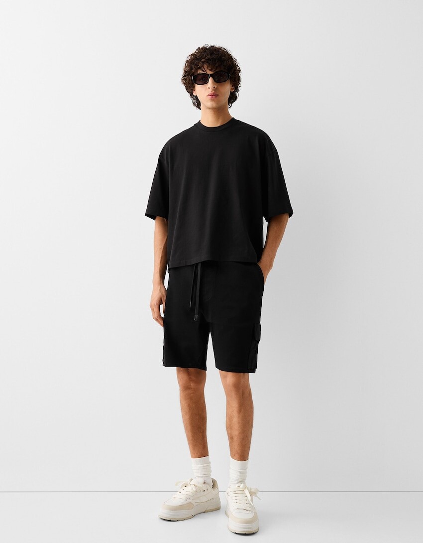 

Мягкие брюки-бермуды для бега Bershka, черный