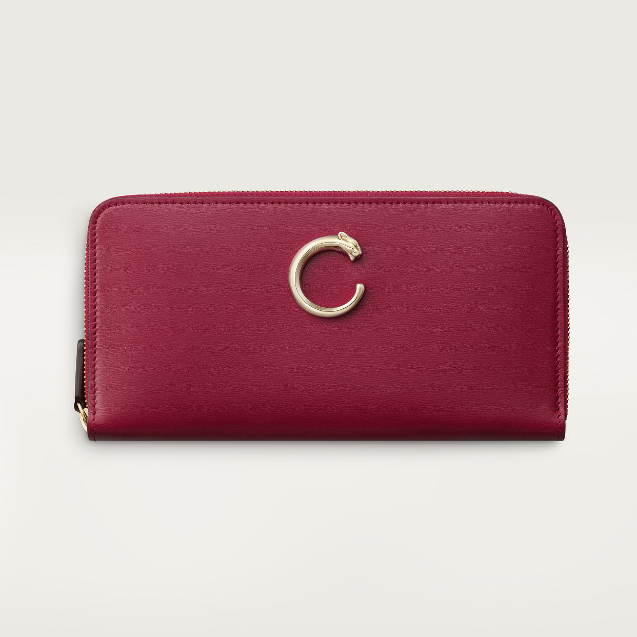 

Кошелек Cartier Portefeuille international zippé, Panthère C de Cartier, телячья кожа вишнево-красного цвета