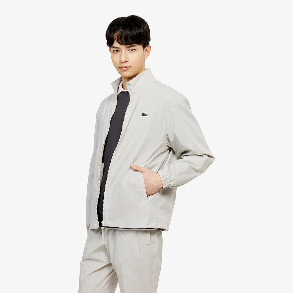 Мужской эластичный тканый пиджак бежевого цвета от Lacoste