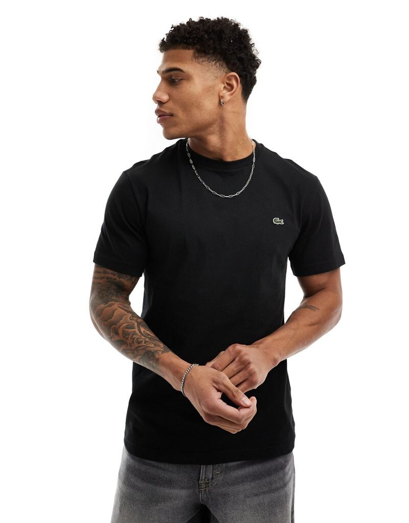 

Lacoste – черная футболка из крокодиловой кожи
