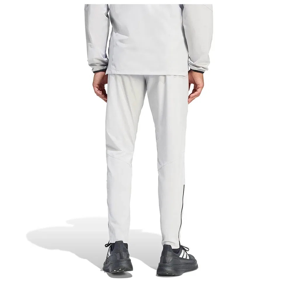 Мужские спортивные брюки с боковыми карманами на молнии Adidas Tiro Travel Woven, Grey — фото 2
