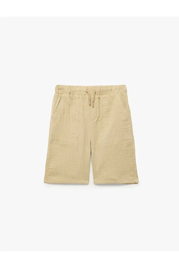 Детские шорты для мальчиков хлопковые Relaxed fit muslin shorts with pockets Koton, Beige — фото 2