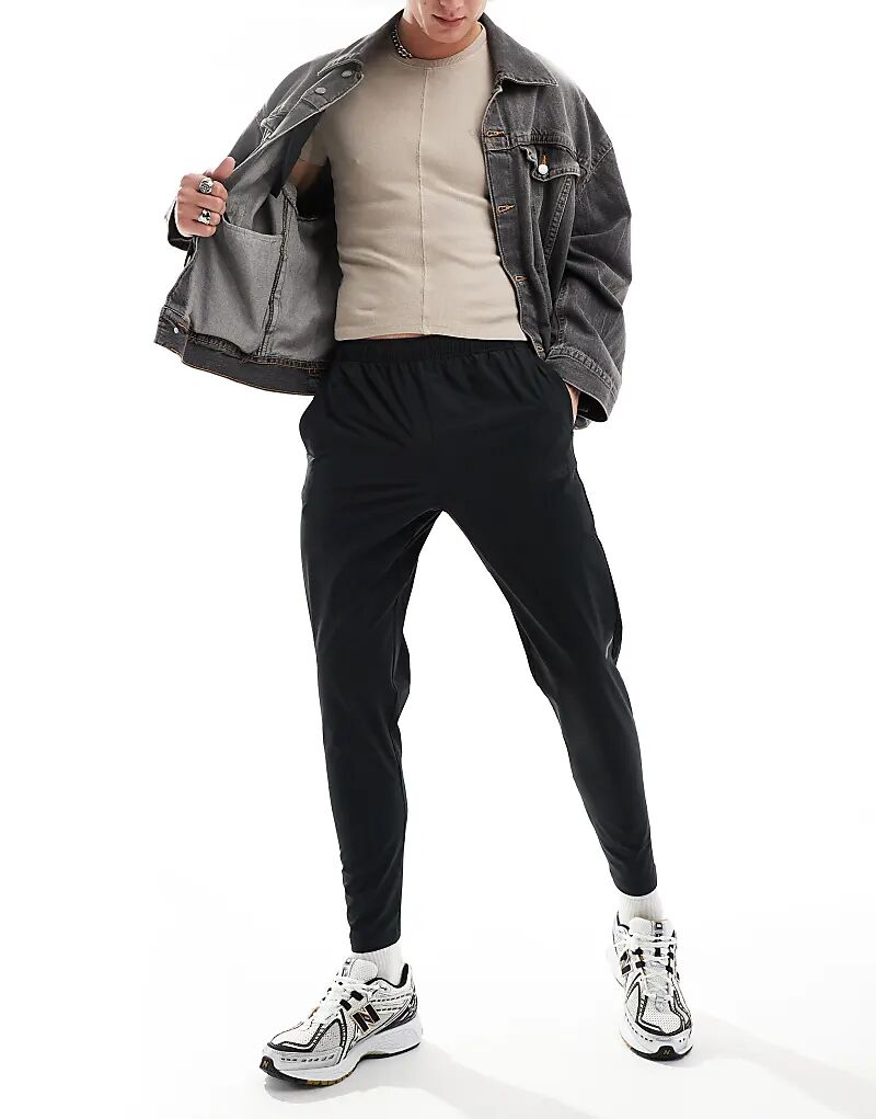 

Тканые брюки Tenacity stretch черного цвета New Balance