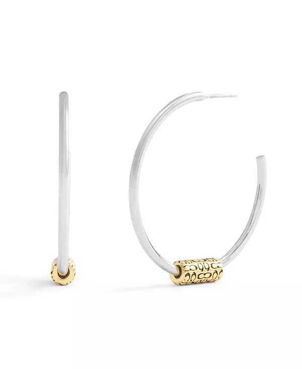 

Большие фирменные стеганые серьги-кольца в форме трубки Coach, silver