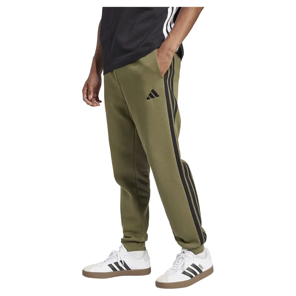 Брюки флисовые с лампасами Adidas Essentials 3 Stripes Fleece joggers, зеленый