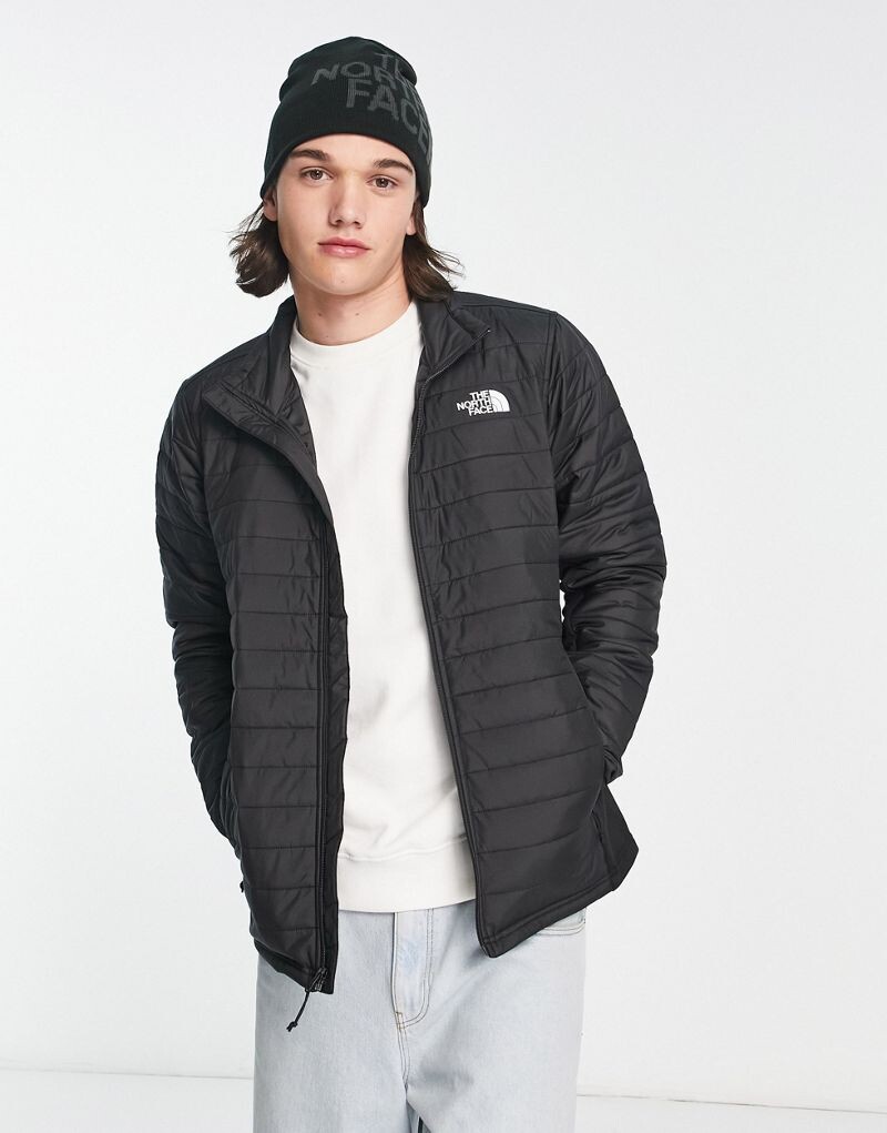 

Черный гибридный пуховик The North Face Canyonlands