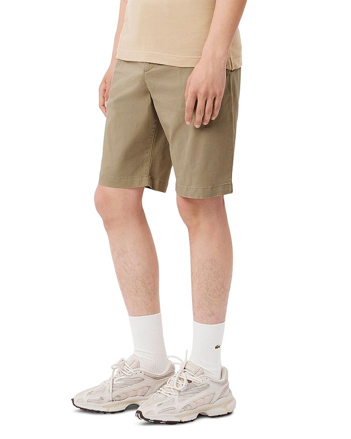 

Узкие хлопковые чинос-шорты с эластаном Lacoste, коричневый/бежевый