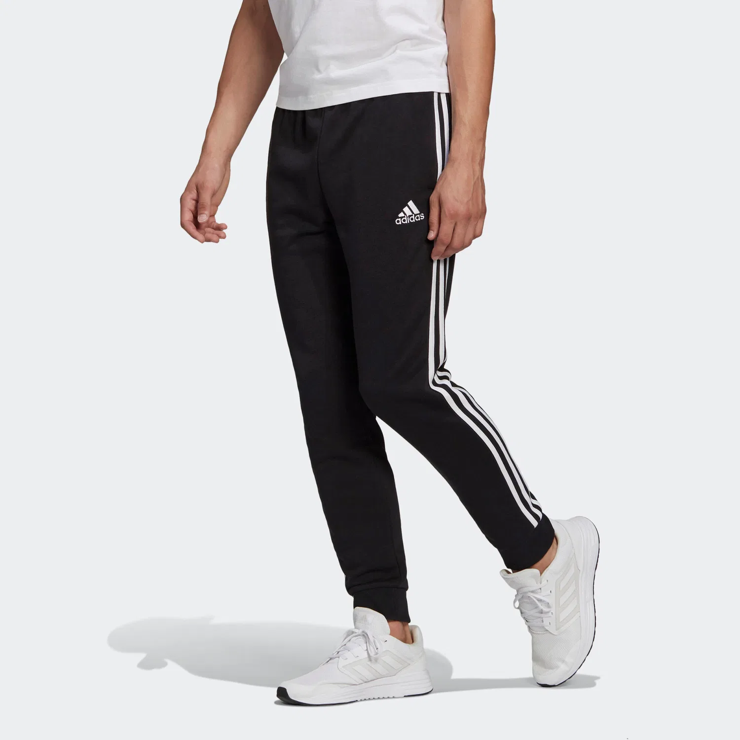 Мужские спортивные штаны из футера с манжетами Essentials French Terry Tapered Cuff 3-Streifen Adidas, Schwarz Weiss — фото 3