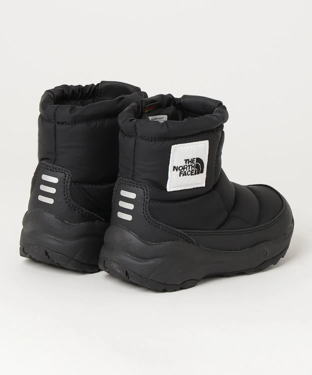 Зимние ботинки The North Face Nuptse Bootie Logo Short детские, чёрно-белые — фото 2