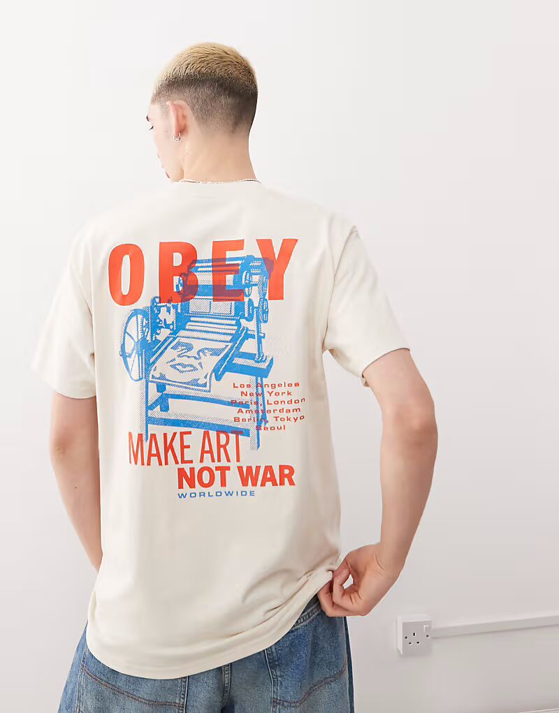 

Футболка Obey с печатным станком и художественным принтом на спине кремового цвета