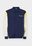 Куртка New Balance ATHLETICS VARSITY JACKET, Navy /Blue - фото 5