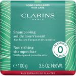 Шампунь CLARINS Shampooing solide nourrissant - Festes Shampoo, 100 g - фото