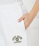 Спортивные штаны женские Guess Jeans хлопковые зауженные, белый - фото 4