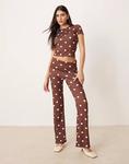 Расклешенные брюки в коричневый горошек Asos Design - фото