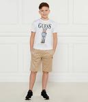 Шорты детские Guess Active трикотажные с принтом, бежевый - фото 2