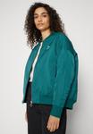 Бомбер Chaquetas Puma SHINY, цвет malachite - фото 6
