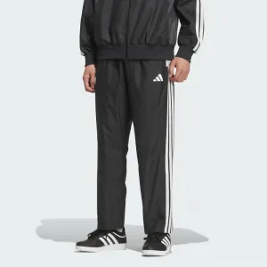 Официальные ветрозащитные брюки adidas Must-Have свободного кроя с цветовыми блоками, сетчатой подкладкой и открытой нижней частью.