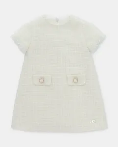 Детское платье из ткани с мелким принтом на бежевом фоне Martín Aranda