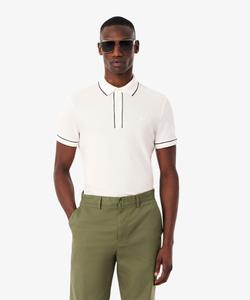 Рубашка-поло из эластичного органического хлопка пике с цветной окантовкой.
