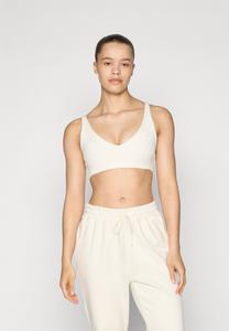 Спортивный бюстгальтер с легкой поддержкой PURELUXE LONGLINE LOW IMPACT BRA Fabletics, кремовый