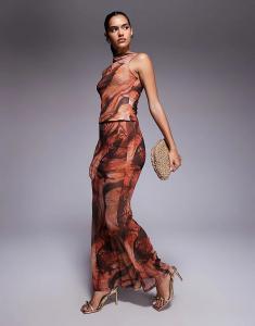 Комбинируйте и сочетайте прозрачную сетчатую юбку макси-фибула ASOS DESIGN с оранжевым абстрактным принтом