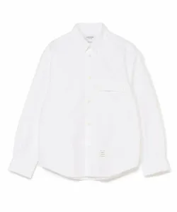 Рубашка оверсайз из пике с двойной строчкой и манжетой из той же ткани.