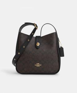 Сумка-трансформер Hadley через плечо из фирменной канвы.