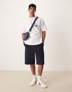 ASOS DESIGN свободные удлиненные текстурированные шорты темно-синего цвета