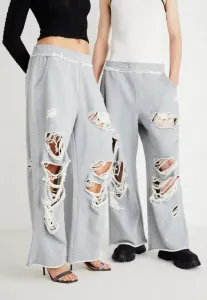 Потертые спортивные штаны унисекс с петлеобразным узором в виде монстра Jaded London, Grey