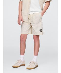 (K) 100% переработанные нейлоновые шорты свободного кроя, надеваемые через голову.