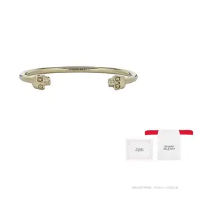 Браслет Twin Skull Alexander McQueen, золотой