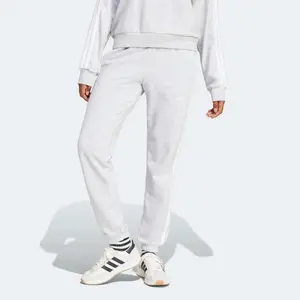 Женские брюки Essentials French Terry с манжетами и 3 полосками adidas, серый