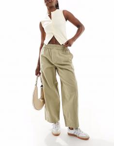 Брюки ASOS DESIGN с эффектом потертости и застежкой-молнией цвета хаки