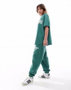 Спортивные брюки ASOS DESIGN с манжетами и принтом Colorado зеленого цвета