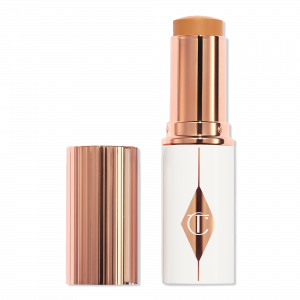 Увлажняющий тональный крем-стик Unreal Skin Sheer Glow Tint Charlotte Tilbury, 10 Tan (tan with warm undertones)