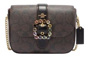 Сумка через плечо Gemma из лакированного холста с гладкой кожей Trumpets для женщин, темно-коричневая COACH